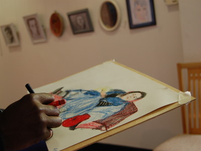 A close-up of a pastel drawing of Chrissy Sabberton.