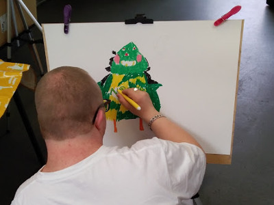 A NANSA artist painting Putinca.