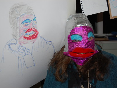 A model wearing a mask posing with her portrait.